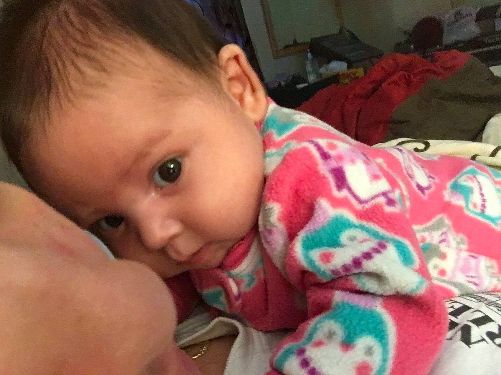 Makayla is registered to the contest to win money with this photo: baby, bedtime, cheek, child, ear, eye, face, finger, forehead, hand, head, iris, lip, mouth, nose, person, skin, smile, thumb, toddler