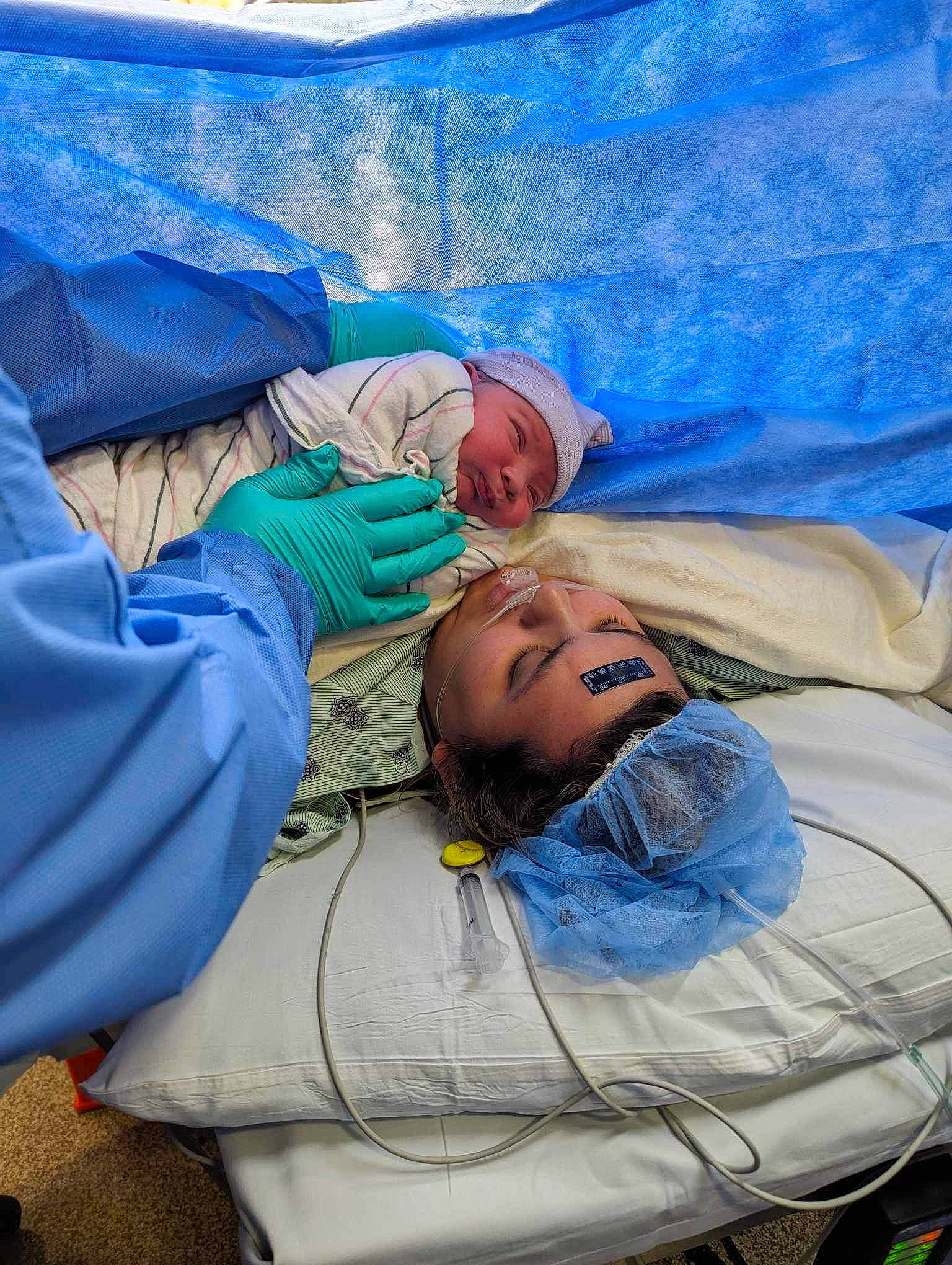 Nico is registered to the contest to win money with this photo: child, comfort, electric_blue, event, headwear, hospital, leisure, linens, medical, nap, person, room, service, sitting, sleep