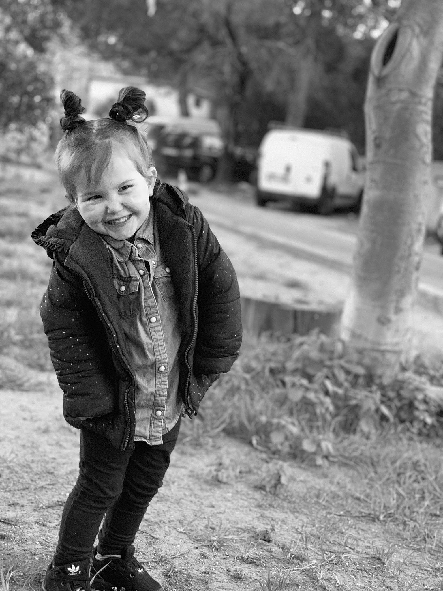 Ywenn participe au concours pour gagner de l'argent avec cette photo : black_and_white, child, child_model, jacket, joy, leather_jacket, monochrome, monochrome_photography, people, person, photograph, photography, plant, play, portrait_photography, smile, snapshot, standing, style, toddler