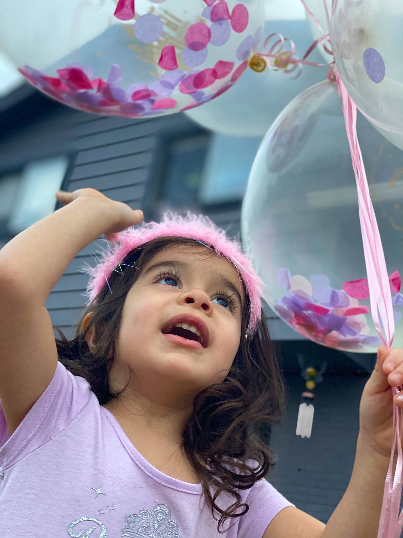 Khloe joined the competition — help win amazing prizes! balloon, beauty, community, event, facial_expression, fun, gesture, happy, headwear, human, leisure, magenta, party_supply, people, person, photograph, pink, purple, smile, social_group