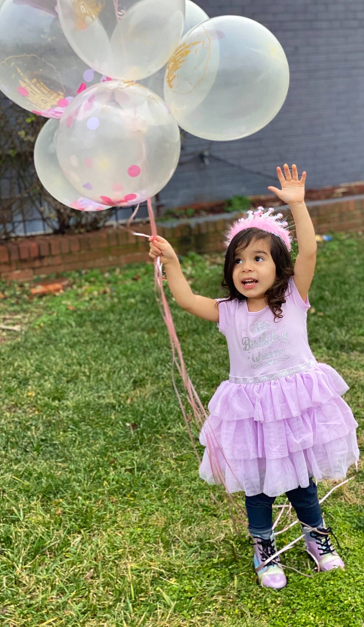 Khloe joined the competition — help win amazing prizes! baby_toddler_clothing, balloon, botany, event, fun, grass, grassland, green, happy, leg, leisure, magenta, party_supply, person, pink, plant, recreation, smile, toddler, white