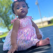 Aniyah joined the competition — help win amazing prizes! toddler, child, outdoor, dress, pink, headband, baby, sitting, face, portrait, curious, trampoline, sunlight, nature, grass, blue_sky, smile, cute, young_child, colorful