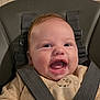 Raphaël participe au concours pour gagner de l'argent avec cette photo : baby, smile, happy, face, child, high_chair, seatbelt, clothing, infant, cute, indoors, person, young_child, expression, mouth_open, cheerful, apparel, seat, baby_clothes, human
