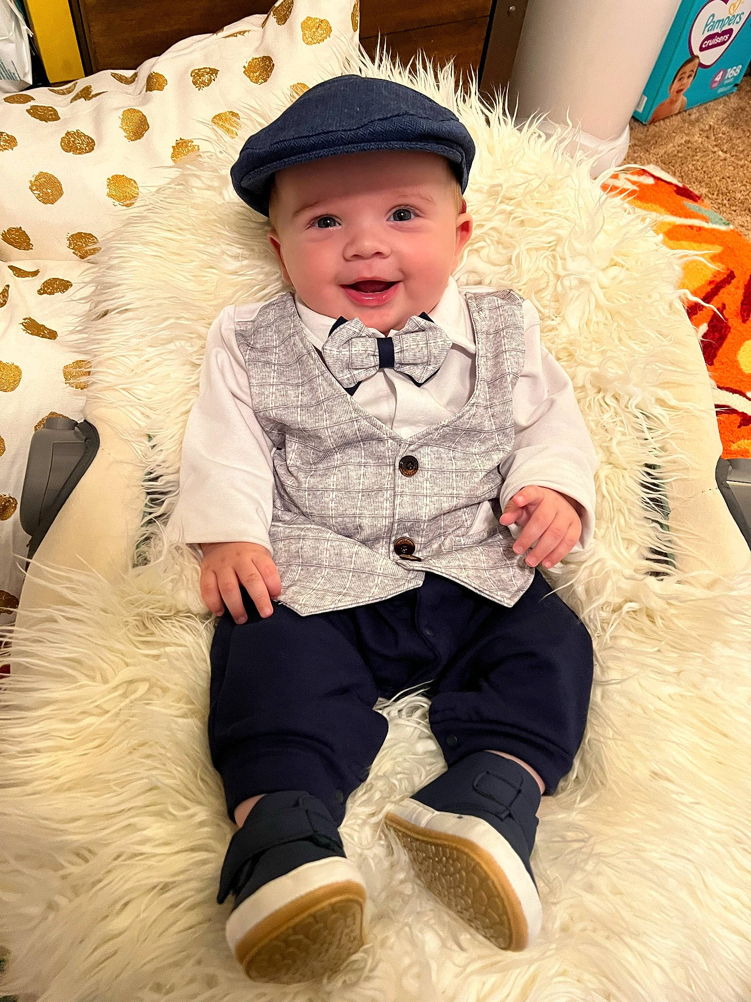 Liam is registered to the contest to win money with this photo: baby, baby_toddler_clothing, child, collar, costume_hat, event, eye, fashion_accessory, fun, fur, happy, hat, headwear, outerwear, pattern, person, sitting, sleeve, smile, sun_hat