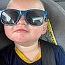 Rhett joined the competition — help win amazing prizes! child, toddler, portrait, car, car_seat, sunglasses, blue_sunglasses, pouting, serious_expression, backseat, seatbelt, vehicle, close_up, indoor, travel, shirt, fashion, face, passenger, road_trip