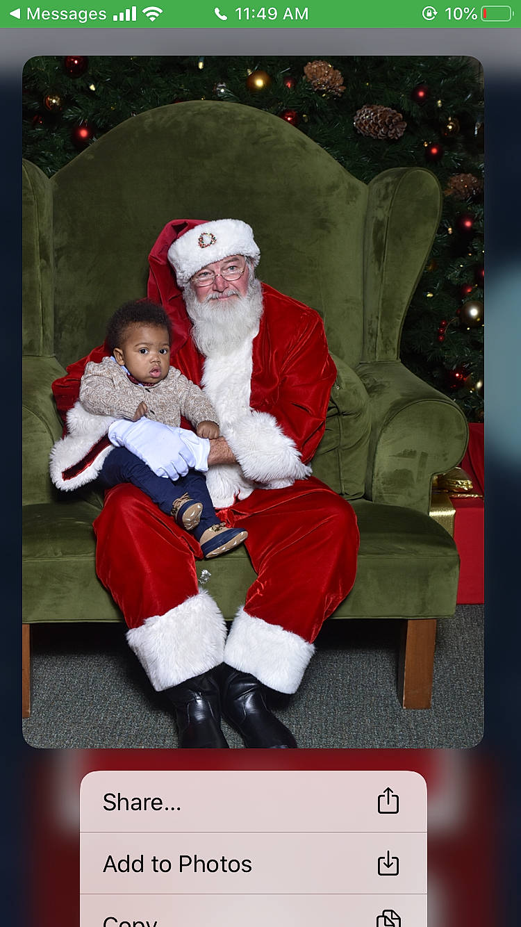 Elijah Aka Fat Daddy is registered to the contest to win money with this photo: christmas, christmas_eve, fictional_character, headwear, lap, person, santa_claus