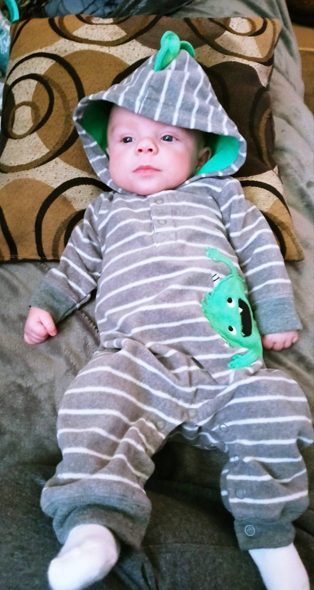 Ryder is registered to the contest to win money with this photo: baby, baby_toddler_clothing, beauty, cheek, child, eye, face, grass, hat, head, headgear, headwear, outerwear, pattern, person, photograph, pink, sitting, skin, sleeve