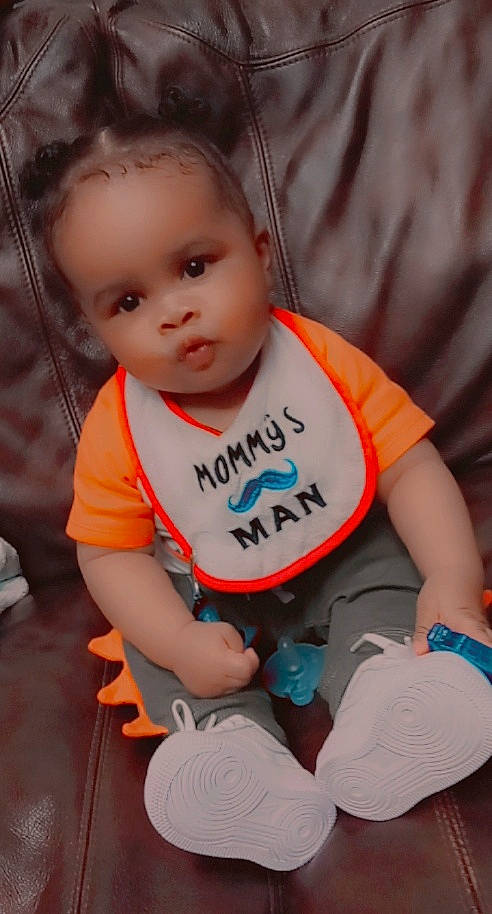 Trenton is registered to the contest to win money with this photo: baby, baby_toddler_clothing, cool, elbow, eye, facial_expression, fun, hairstyle, happy, human_body, human_leg, leg, orange, person, skin, sleeve, standing, t_shirt, thigh, thumb