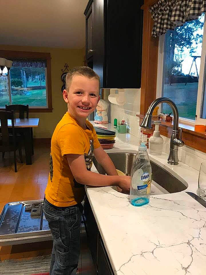Thomas joined the competition — help win amazing prizes! bottle, countertop, drinking_water, engineering, flooring, gas, joy, kitchen, person, plastic_bottle, plumbing, plumbing_fixture, sink, smile, solvent, t_shirt, table, tap, television, water_bottle