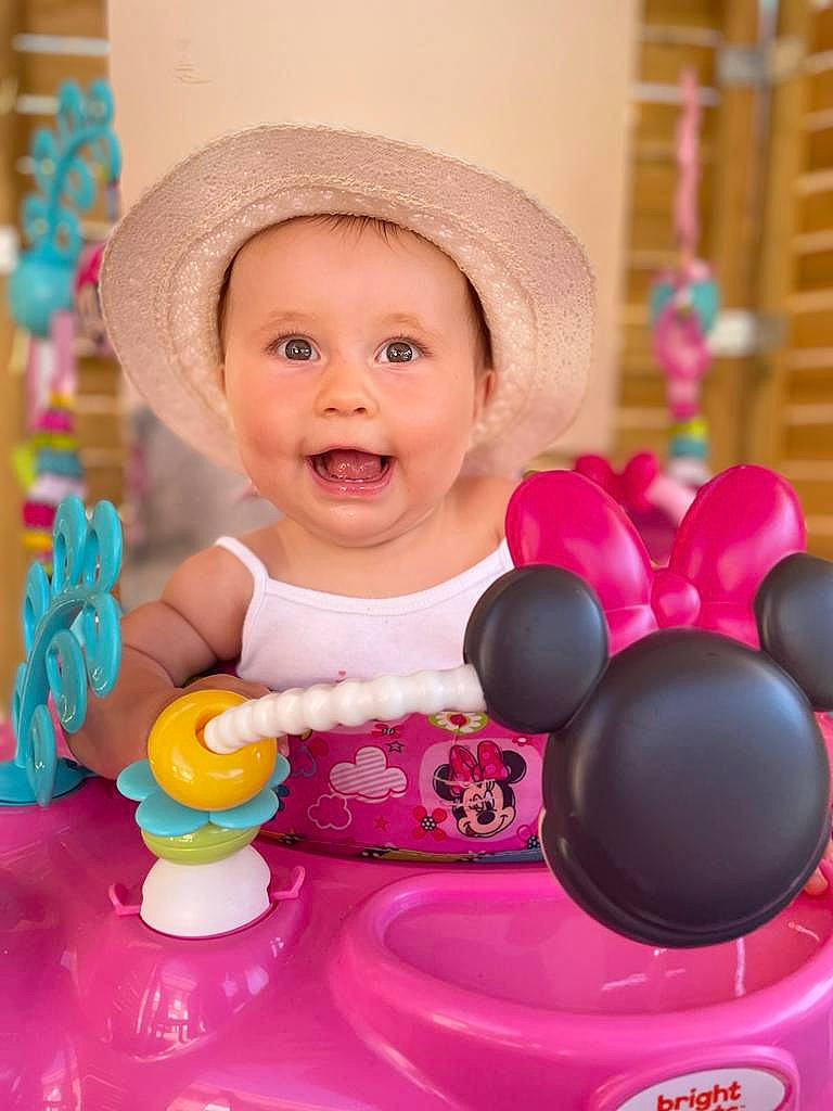 Sofia participe au concours pour gagner de l'argent avec cette photo : baby, baby_playing_with_toys, baby_toddler_clothing, face, facial_expression, fedora, fun, happy, hat, headwear, people, person, photograph, pink, product, purple, riding_toy, skin, smile, sun_hat