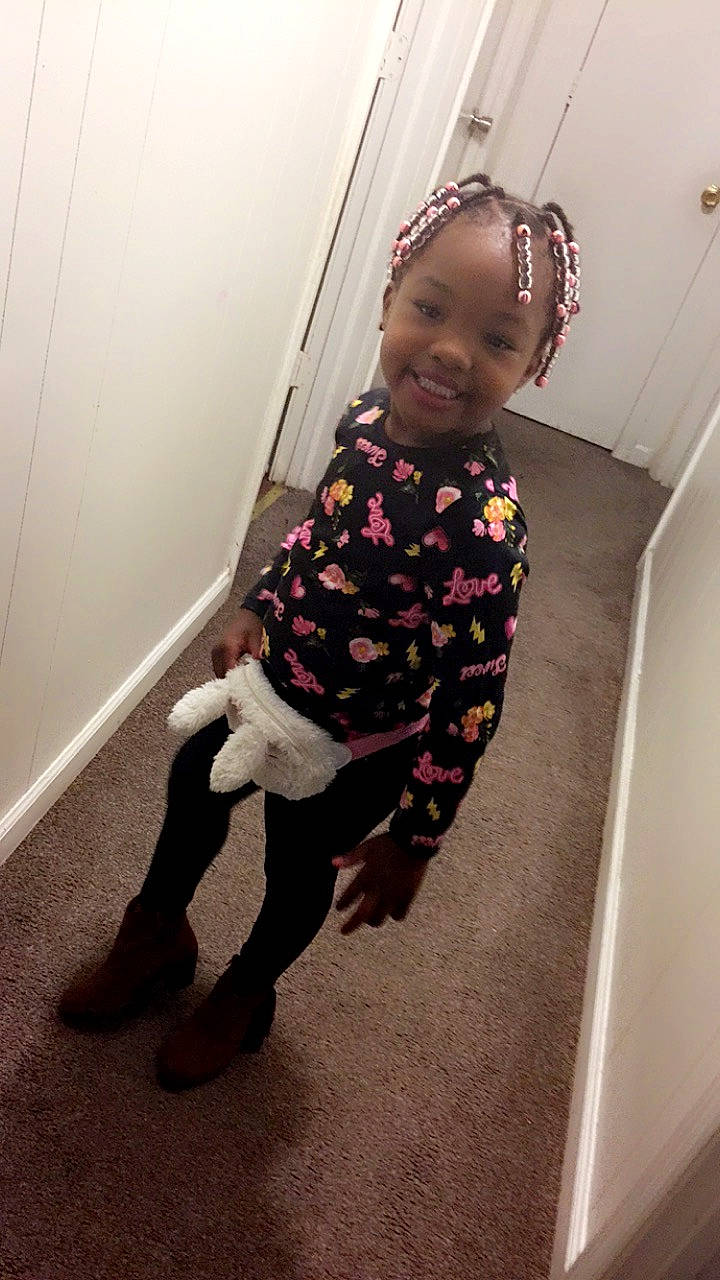 Summer is registered to the contest to win money with this photo: baby_toddler_clothing, child, door, dress, face, floor, flooring, fun, happy, human_leg, joy, knee, magenta, outerwear, pattern, person, sleeve, smile, sock, t_shirt