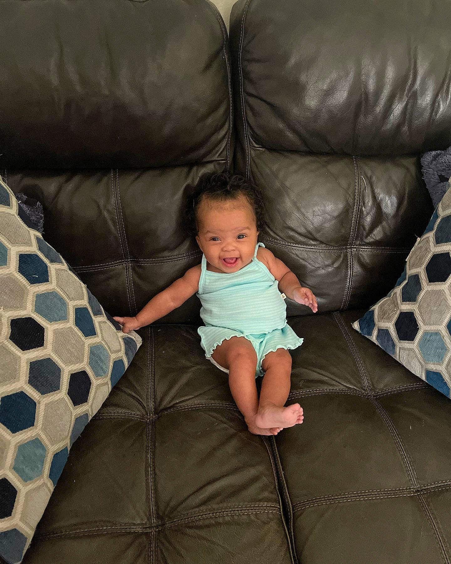 Ryliegh joined the competition — help win amazing prizes! baby, baby_toddler_clothing, comfort, couch, flooring, furniture, human_leg, lap, leg, linens, living_room, pattern, person, pillow, purple, sitting, sofa_bed, studio_couch, textile, throw_pillow