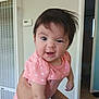 baby, child, infant, pink_clothing, polka_dots, cute, funny_face, hair, indoor, person, expression, smile, hands, portrait, holding, room, wall, doorway, light, home