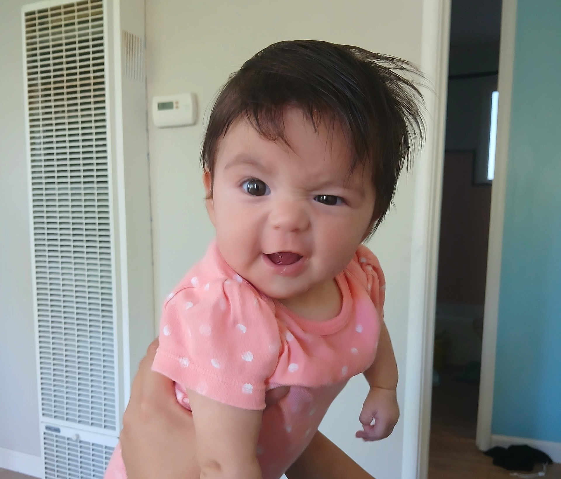 Samara joined the competition — help win amazing prizes! baby, child, infant, pink_clothing, polka_dots, cute, funny_face, hair, indoor, person, expression, smile, hands, portrait, holding, room, wall, doorway, light, home