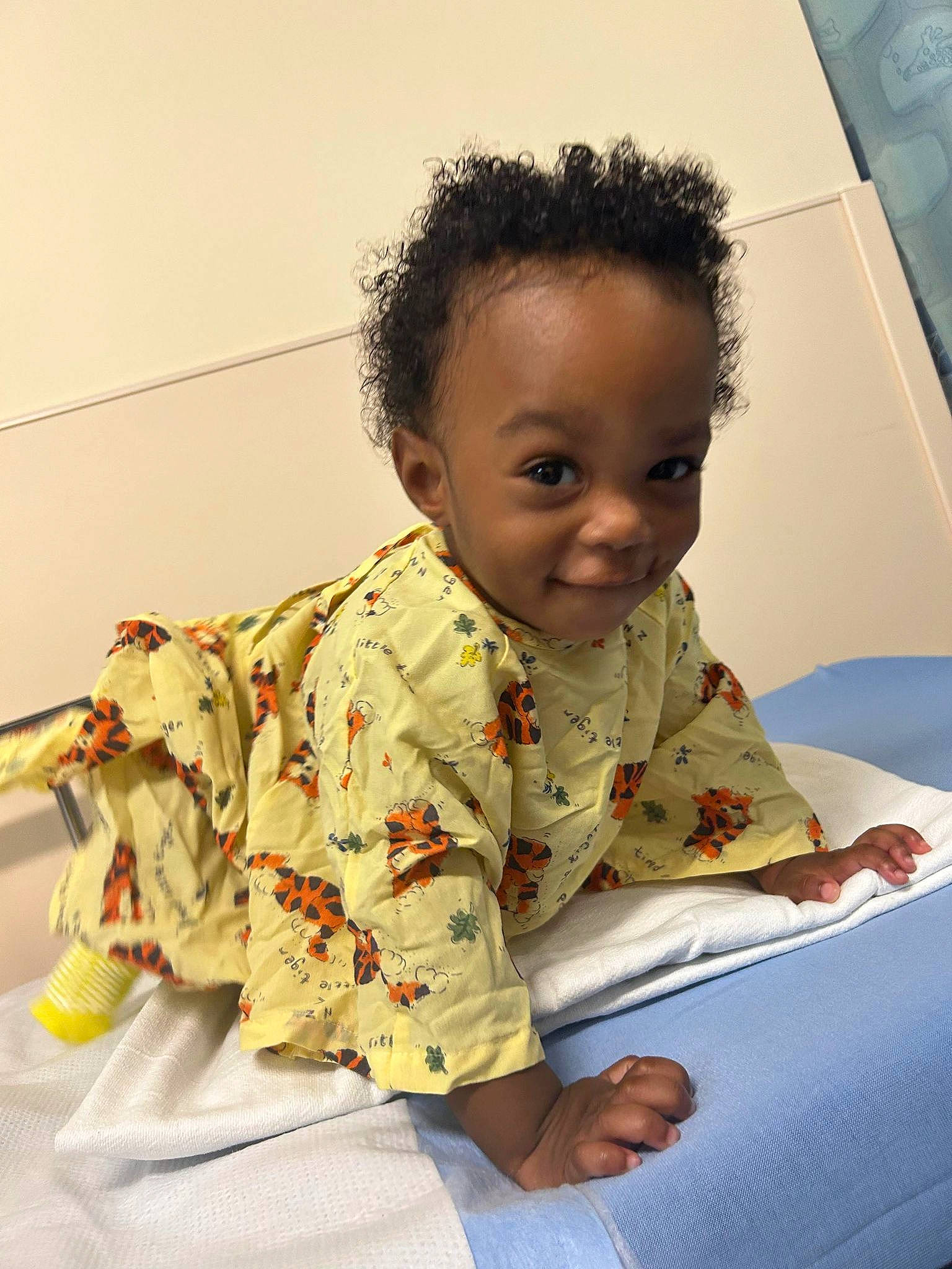 Sakai James is registered to the contest to win money with this photo: baby, baby_products, baby_toddler_clothing, child, chin, comfort, flooring, fun, happy, linens, person, play, room, sitting, skin, sleeve, smile, t_shirt, toddler