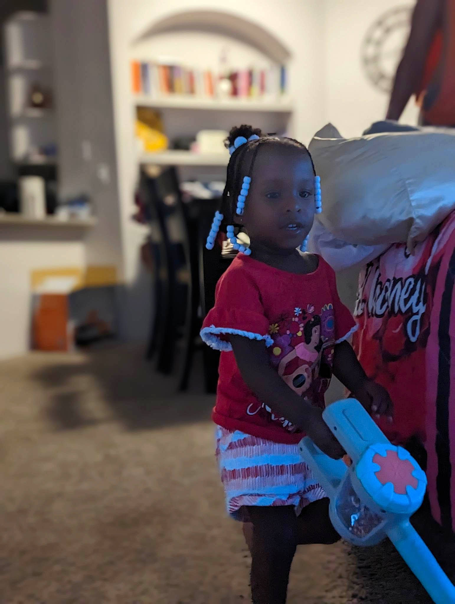 Kamari is registered to the contest to win money with this photo: automotive_tire, automotive_wheel_system, child, electric_blue, flooring, fun, happy, leisure, magenta, person, personal_protective_equipment, recreation, t_shirt, toddler, vacation