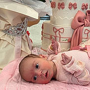 Elisaveta joined the competition — help win amazing prizes! baby, infant, blanket, pink, cake, birthday_cake, decorations, flowers, tiara, gift_wrap, ribbons, cute, portrait, celebration, soft_texture, knitted, newborn, laying_down, indoor, closeup