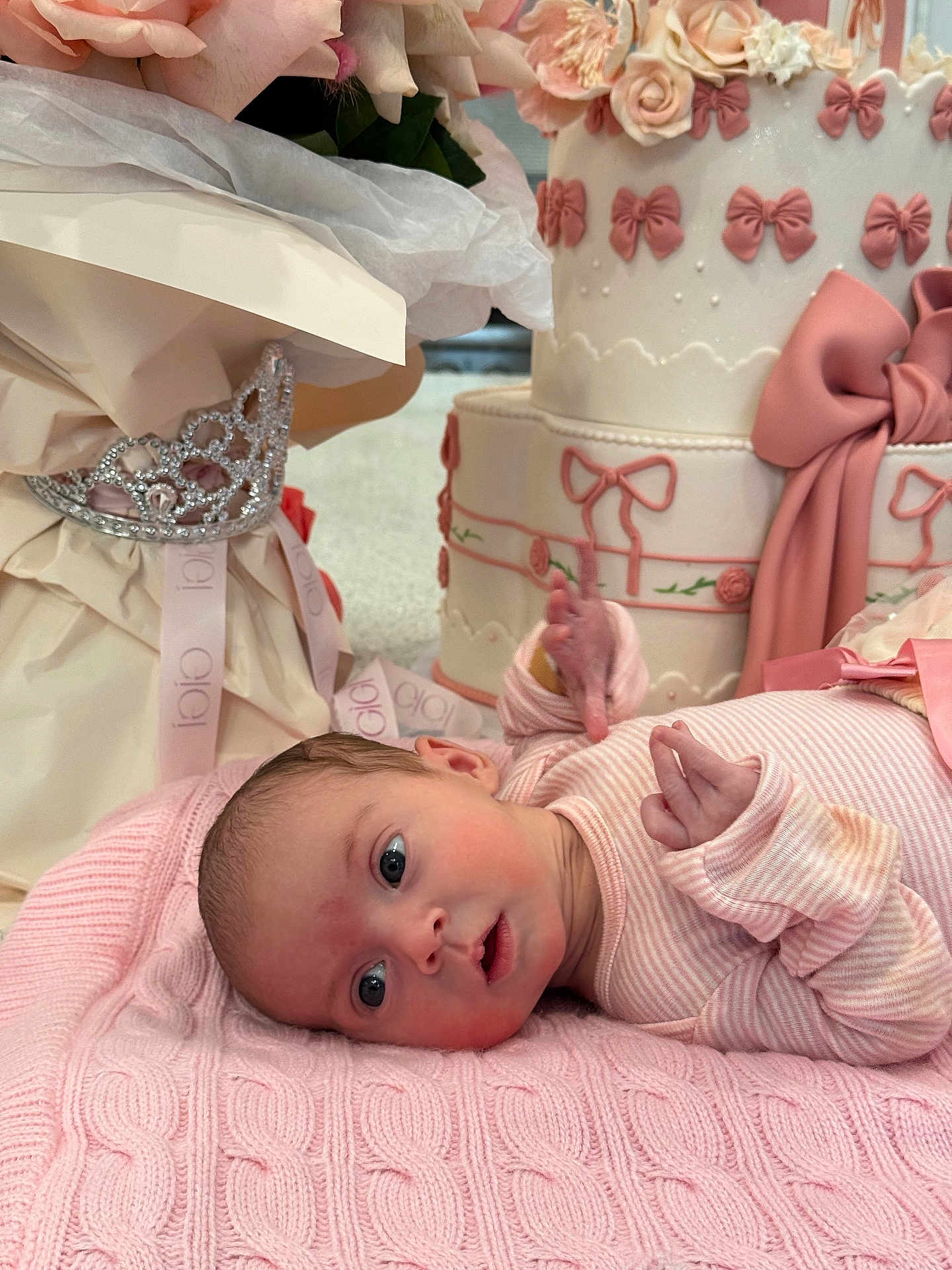 Elisaveta joined the competition — help win amazing prizes! baby, infant, blanket, pink, cake, birthday_cake, decorations, flowers, tiara, gift_wrap, ribbons, cute, portrait, celebration, soft_texture, knitted, newborn, laying_down, indoor, closeup