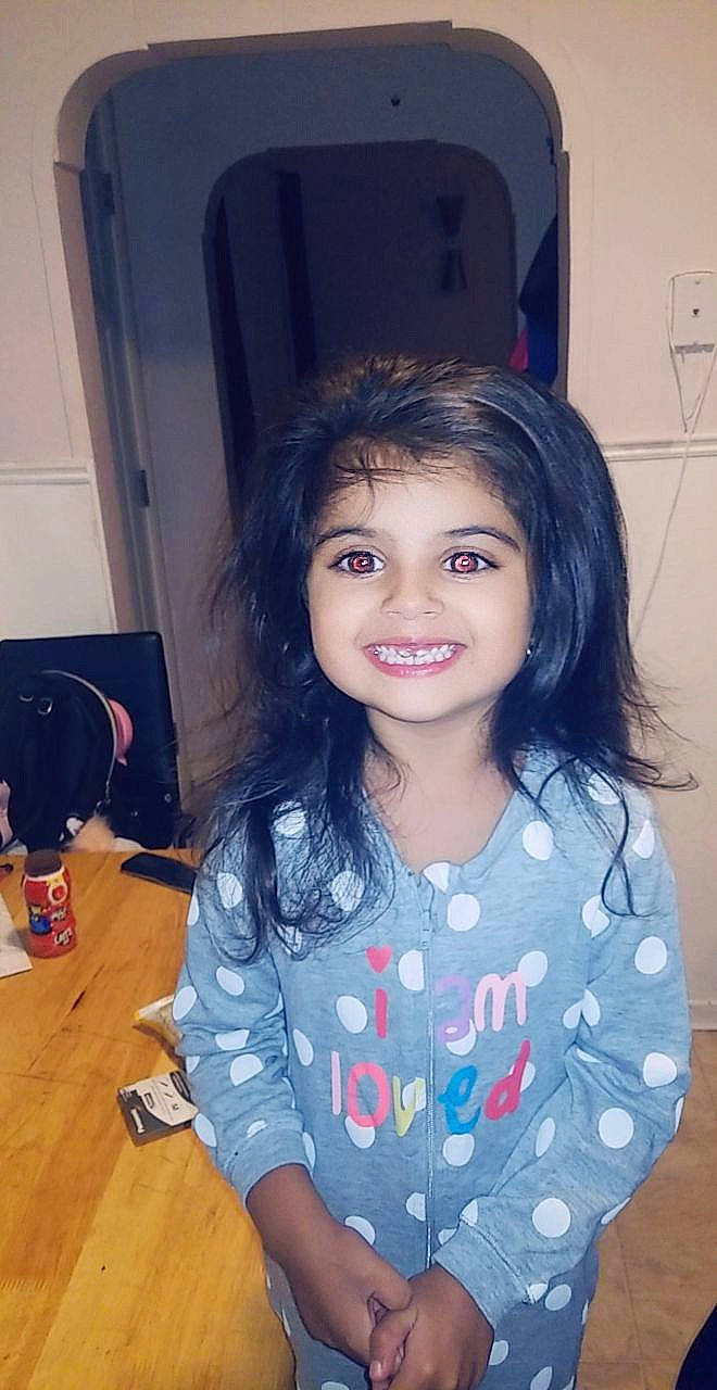 Sophia is registered to the contest to win money with this photo: cheek, child, cool, electric_blue, eye, eyelash, flash_photography, flooring, fun, happy, iris, joy, long_hair, nose, pattern, person, skin, sleeve, smile, standing