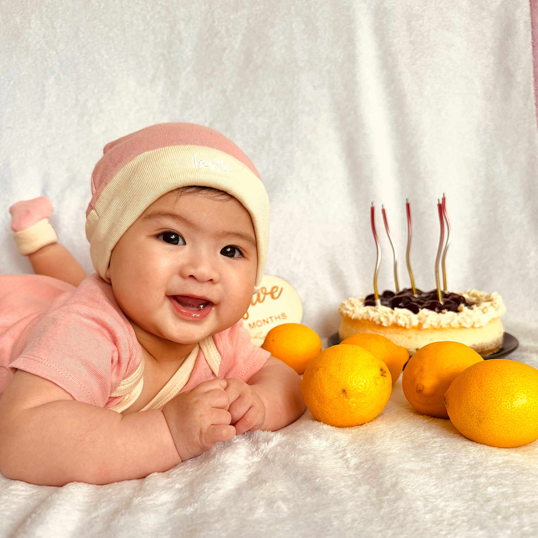 Janaiah is registered to the contest to win money with this photo: baby, birthdaycake, bodypart, cake, citrusfruit, clothing, cream, dessert, face, finger, food, fruit, grapefruit, hat, head, person, photography, plant, portrait, produce