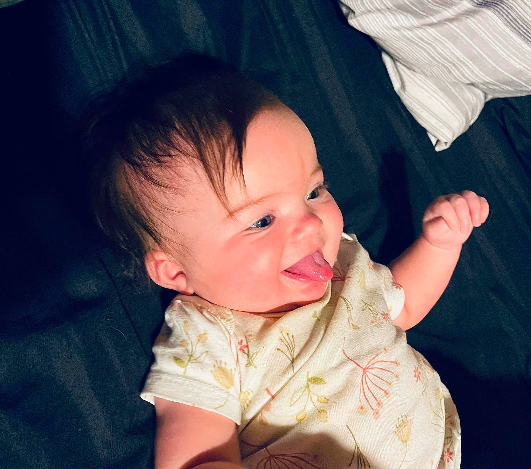 Laikyn is registered to the contest to win money with this photo: baby, baby_toddler_clothing, cheek, eye, face, finger, flash_photography, gesture, happy, head, human_body, iris, lip, mouth, nose, person, pink, skin, sleeve, smile