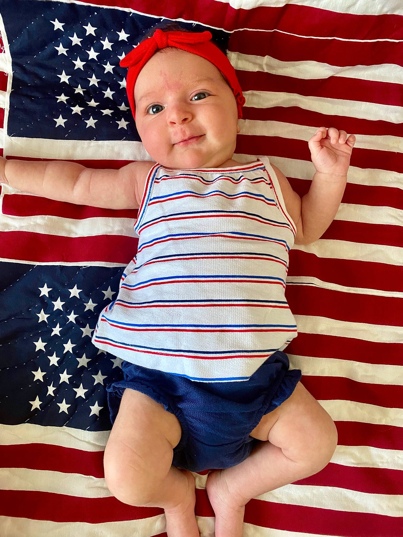 Cora joined the competition — help win amazing prizes! baby, baby_toddler_clothing, blue, child, electric_blue, event, face, flag_of_the_united_states, happy, human_leg, knee, pattern, person, red, sleeve, smile, standing, t_shirt, thigh, toddler