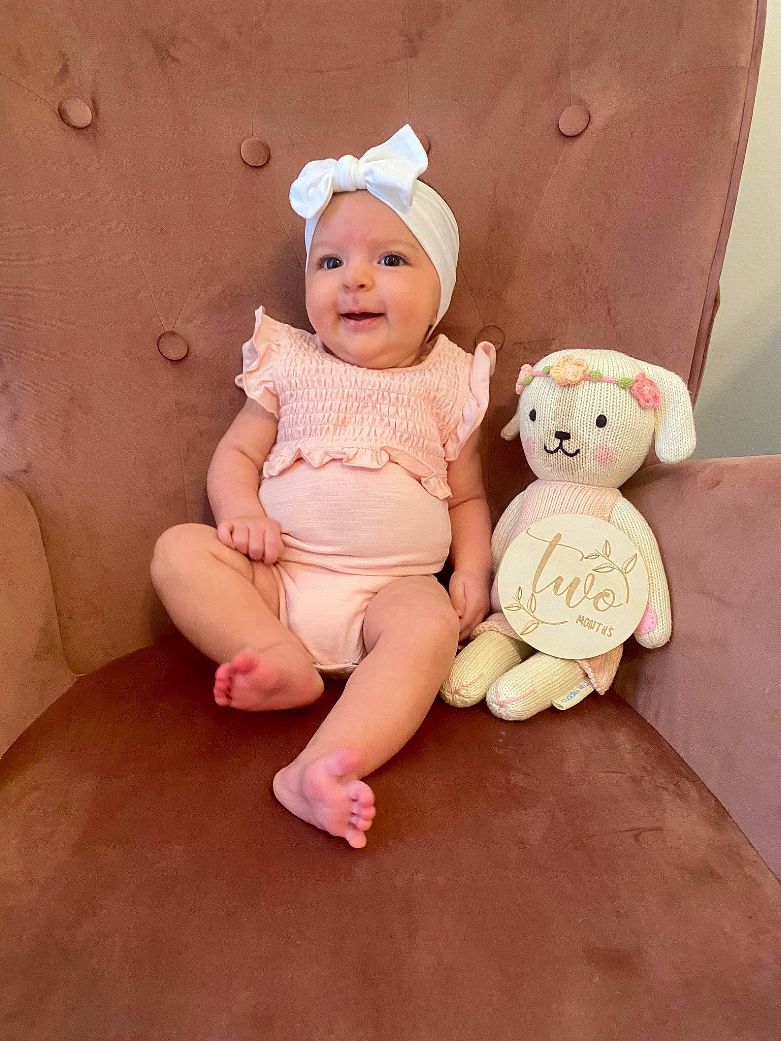 Cora joined the competition — help win amazing prizes! baby, baby_toddler_clothing, cheek, child, comfort, foot, happy, headwear, human_leg, knee, peach, person, pink, room, sitting, skin, stuffed_toy, teddy_bear, thigh, toddler