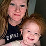 Hope is registered to the contest to win money with this photo: woman, child, toddler, smiling, red_hair, indoor, portrait, face, person, happy, casual_clothing, closeup, family, cute, light_skin, young_child, mother_and_child, human, head_and_shoulders, friendly