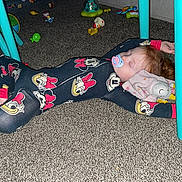 Hope joined the competition — help win amazing prizes! child, pajamas, pacifier, sleeping, carpet, toy, blanket, table, floor, playroom, stuffed_animal, red_hair, indoor, comfort, relaxation, child_sleeping, baby, furniture, colorful_clothing, peaceful