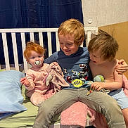 Hope is registered to the contest to win money with this photo: child, baby, toddler, siblings, bed, pajamas, pacifier, toy, smile, happy, cuddle, hair, shirt, pants, blanket, pillow, indoor, family, cute, playful