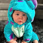 Noah joined the competition — help win amazing prizes! baby, child, onesie, costume, blue, purple, crawling, carpet, cute, indoor, soft, plush, face, hands, feet, hood, expression, person, toddler, infant