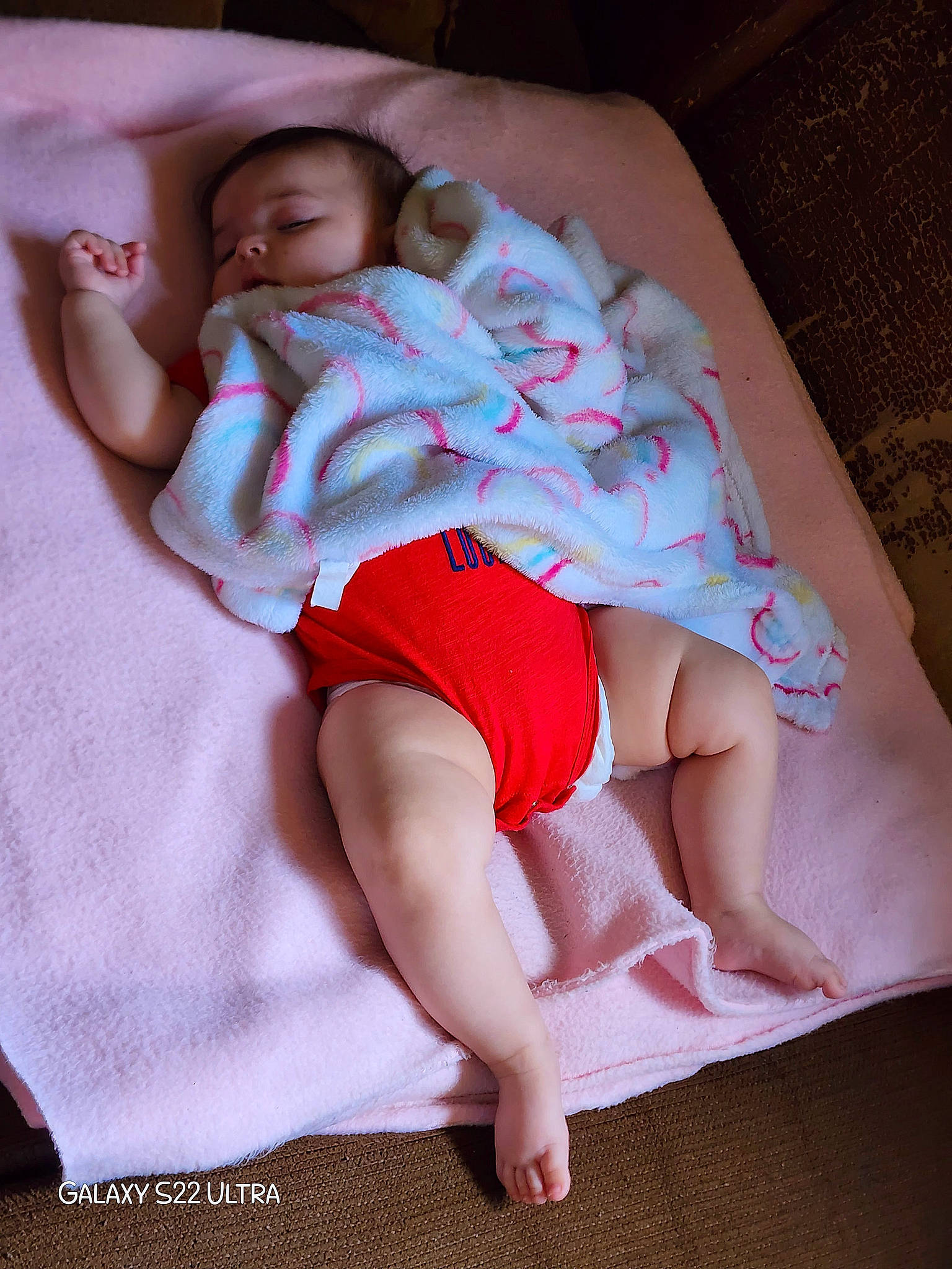 Lydia is registered to the contest to win money with this photo: abdomen, baby_toddler_clothing, barefoot, comfort, elbow, face, finger, human_body, joint, knee, leg, mouth, neck, person, pink, shorts, skin, sleeve, stomach, thigh