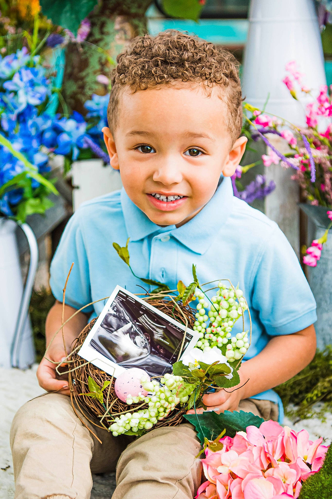 Rylan joined the competition — help win amazing prizes! beauty, blue, botany, child, dress, facial_expression, flower, flower_arranging, fun, grass, green, happy, joy, person, petal, photograph, pink, plant, smile, summer