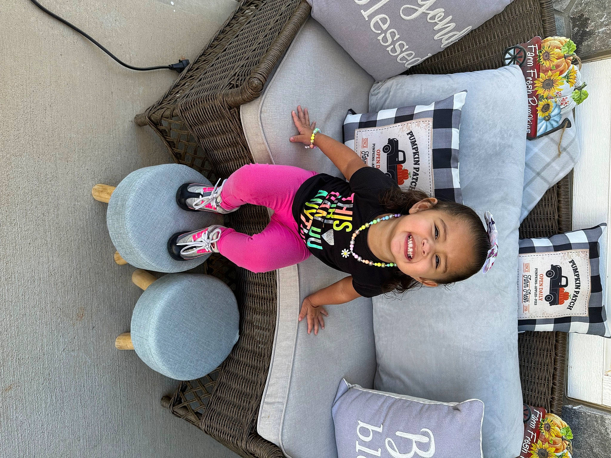 Mariah is registered to the contest to win money with this photo: baby_products, bedding, child, comfort, couch, flooring, font, fun, hat, house, joy, linens, person, pillow, play, room, sitting, smile, t_shirt, throw_pillow
