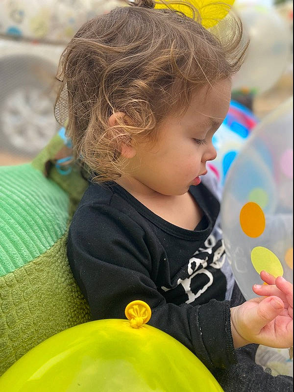 Lukah is registered to the contest to win money with this photo: baby, baby_playing_with_toys, baby_toddler_clothing, child, event, facial_expression, fun, grass, happy, head, leisure, person, photograph, photography, play, recreation, sitting, t_shirt, toddler, vacation