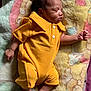 Eliézer participe au concours pour gagner de l'argent avec cette photo : newborn, baby, sleeping, yellow_onesie, blanket, infant, soft_texture, peaceful, portrait, indoors, child, cute, small_hands, small_feet, skin, clothing, lying_down, rest, face, relaxation