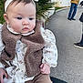 Emy a rejoint le concours — aidez-le/la à gagner de superbes lots ! adult, baby, blue_eyes, brown_vest, candid, cheeks, child, face, floral_dress, hand, headband, infant, jacket, jeans, outdoors, pavement, plant, portrait, shoes, sitting