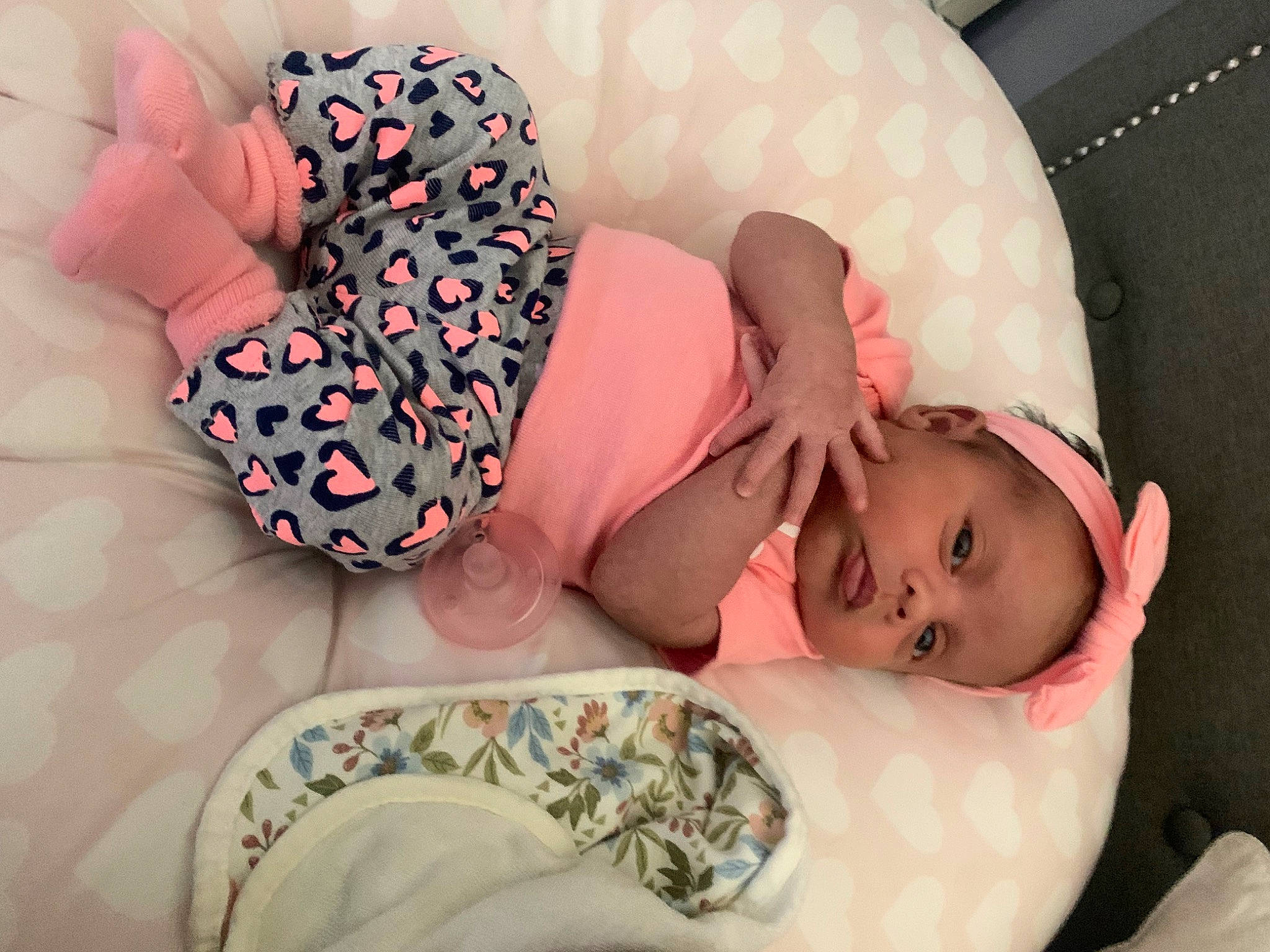 Abigail is registered to the contest to win money with this photo: arm, baby, baby_sleeping, baby_toddler_clothing, bedtime, child, comfort, finger, hand, headgear, human_body, leg, linens, mouth, nail, pattern, person, pink, skin, sleeve