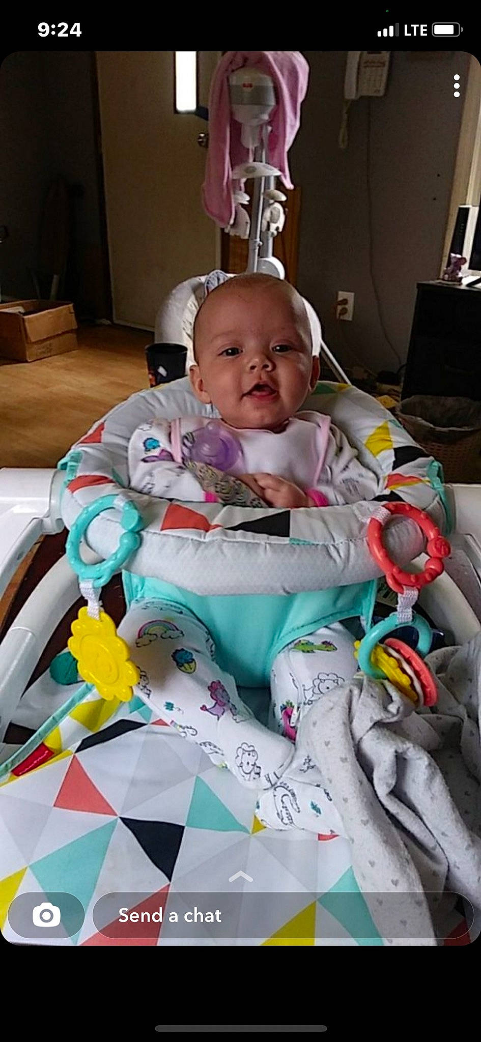 Audree is registered to the contest to win money with this photo: baby, baby_products, baby_toddler_clothing, carmine, cheek, child, comfort, fun, houseplant, linens, pattern, person, pink, plastic, play, product, room, sitting, textile, toddler