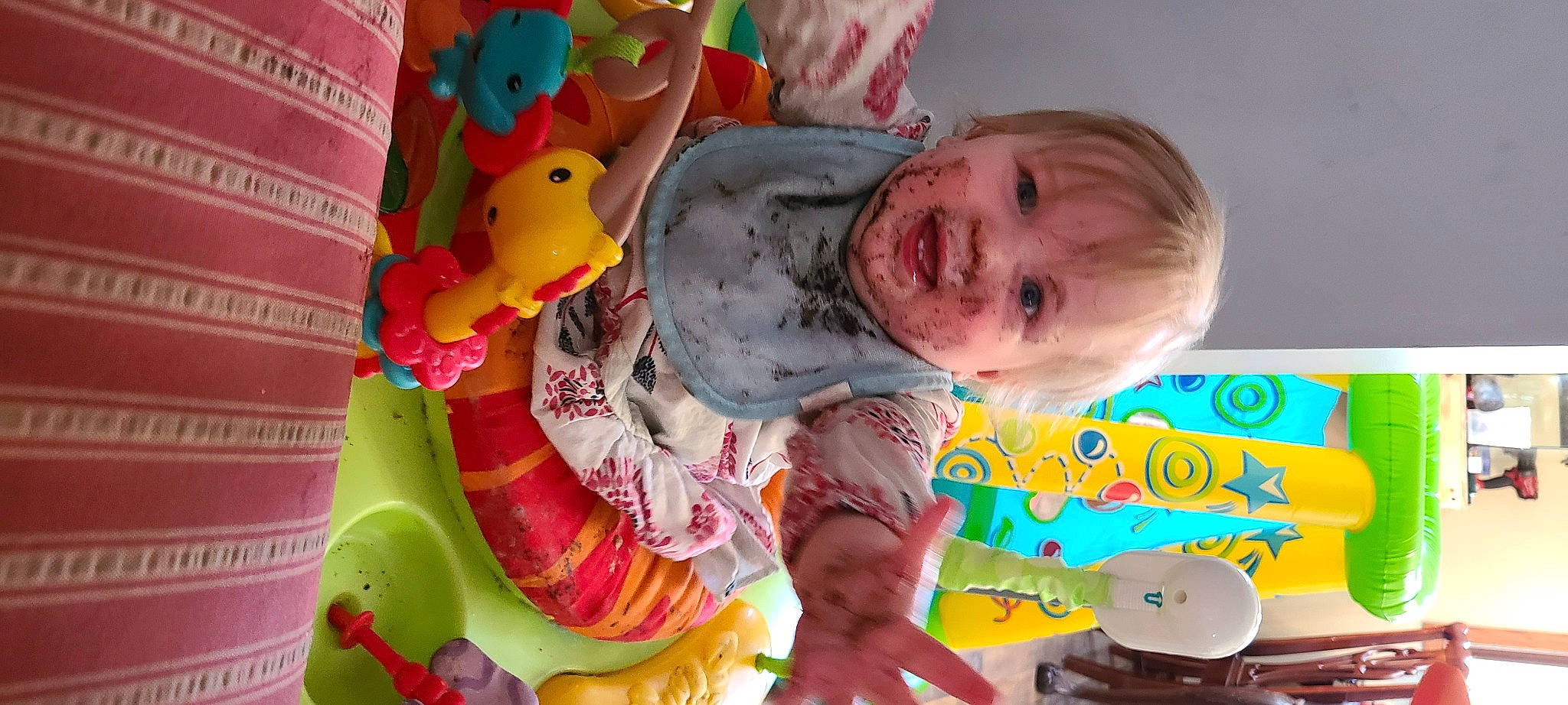 Phoenix is registered to the contest to win money with this photo: baby, baby_playing_with_toys, baby_products, baby_toddler_clothing, baby_toys, cheek, child, coffee_cup, fun, happy, person, photography, play, room, smile, snapshot, toddler, toy, yellow