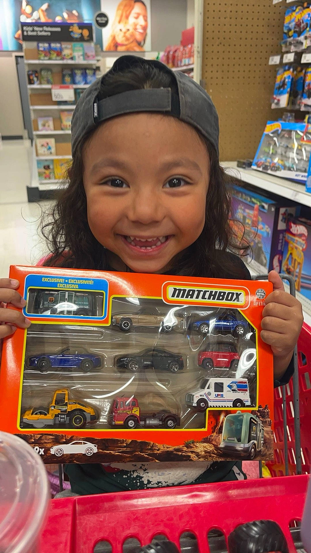 Hendrix is registered to the contest to win money with this photo: baseballcap, bodypart, cap, car, child, clothing, face, female, finger, girl, hand, hat, head, machine, person, photography, portrait, shelf, transportation, vehicle