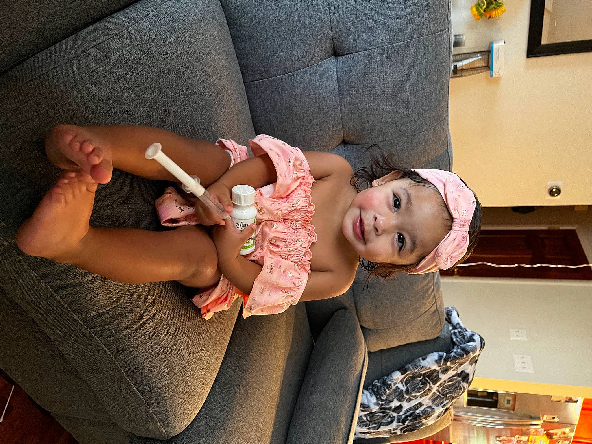 Isabella Jubilee joined the competition — help win amazing prizes! baby, baby_products, baby_toddler_clothing, child, comfort, couch, elbow, eye, fun, happy, human_body, human_leg, joy, knee, lap, person, picture_frame, room, sitting, skin