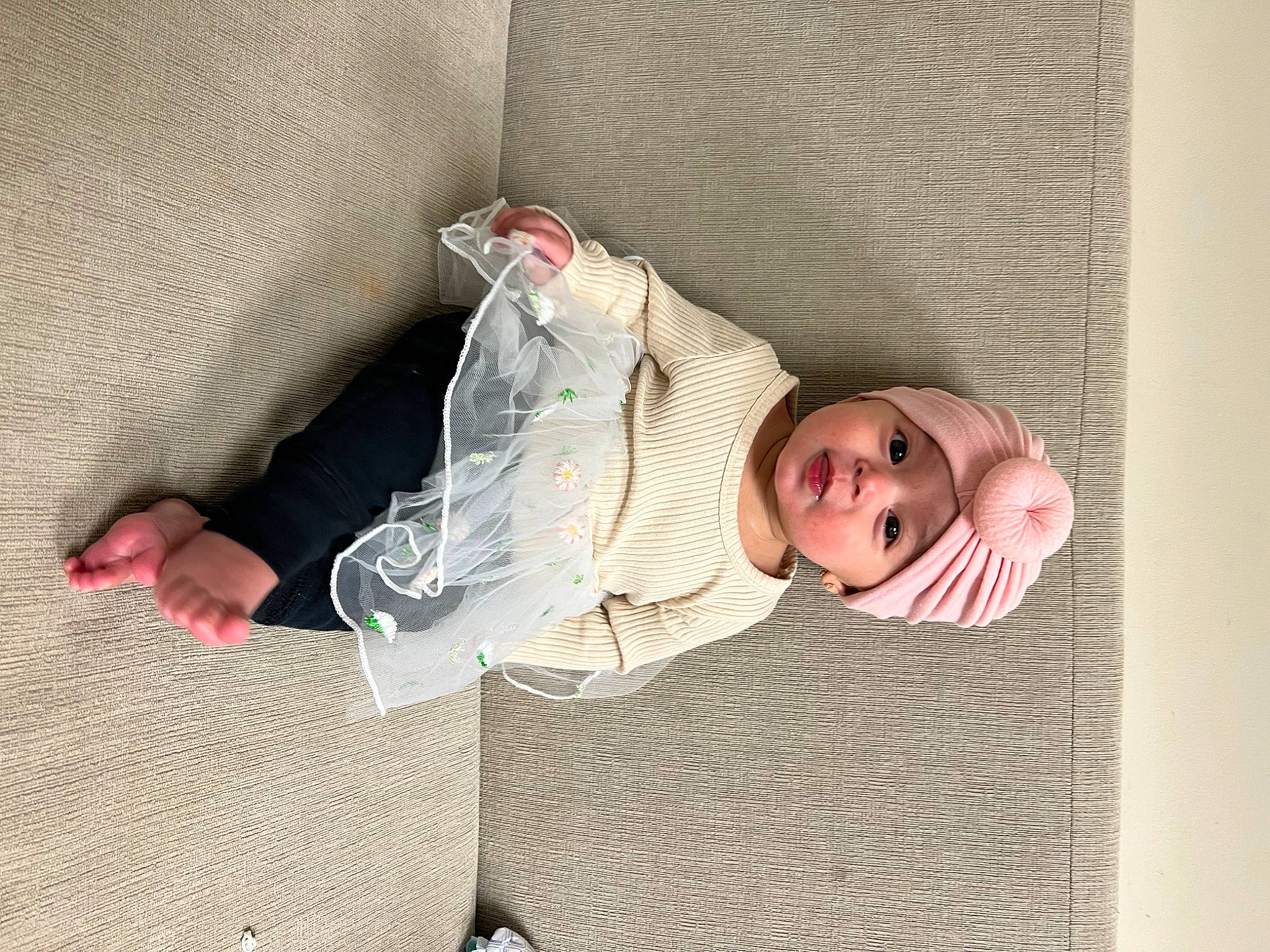 Belen Ahava is registered to the contest to win money with this photo: baby, baby_products, bedding, child, comfort, eyewear, flooring, glasses, headwear, human_body, human_leg, knee, linens, nap, person, room, sitting, sleeve, sunglasses, textile