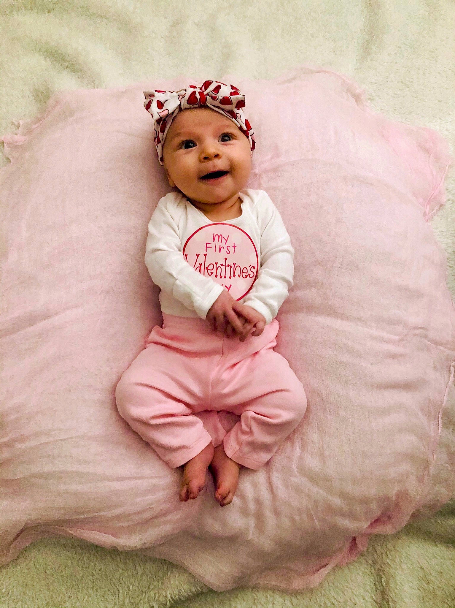 Aurelia joined the competition — help win amazing prizes! baby, baby_toddler_clothing, cap, comfort, face, flash_photography, grass, happy, head, headband, headpiece, headwear, jewellery, lip, magenta, peach, person, pink, sleeve, smile