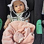 baby, infant, car_seat, hat, white_hat, blanket, plush_toy, bunny, pink_blanket, child, cute, seat_belt, safety_harness, outdoor, daylight, person, face, looking, baby_clothes, soft_toy