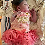 Shopia Vantrease joined the competition — help win amazing prizes! newborn, baby, sleeping, tutu, pink, graduation_cap, hospital, blanket, clothing, cute, infant, person, sleep, toddler, wearing, footwear, sock, bed, indoors, rest
