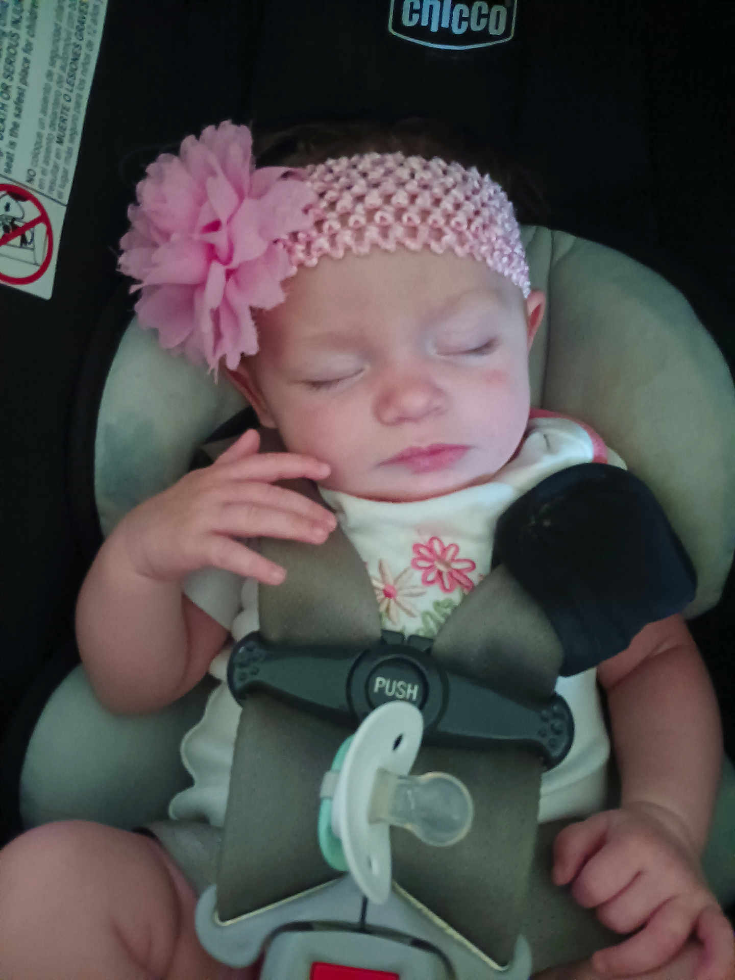 Shopia Vantrease is registered to the contest to win money with this photo: baby, infant, car_seat, headband, flower, pacifier, safety_straps, sleeping, child, cute, pink, clothing, hand, face, portrait, seat, child_seat, resting, toddler, young_child