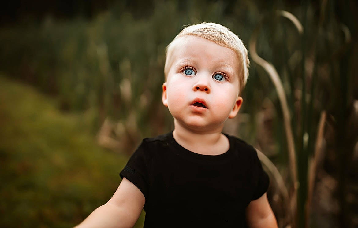 Lance is registered to the contest to win money with this photo: baby, baby_toddler_clothing, child, darkness, flash_photography, fun, grass, happy, laugh, monochrome, monochrome_photography, people_in_nature, person, plant, portrait, portrait_photography, sitting, surprise, t_shirt, toddler