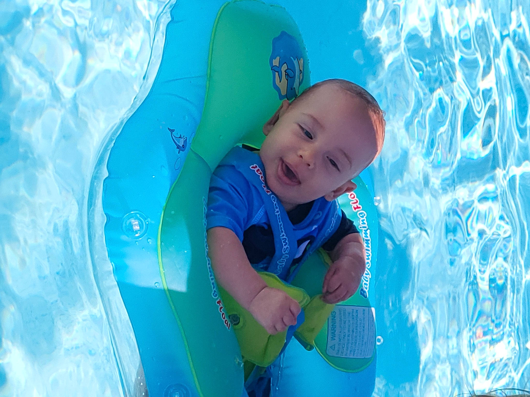 Johnathan joined the competition — help win amazing prizes! aqua, azure, baby, child, cloud, electric_blue, facial_expression, fun, happy, inflatable, leisure, people_in_nature, person, play, product, recreation, sky, smile, swimming_pool, toddler