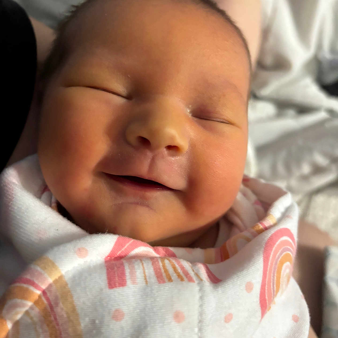 Carolyn is registered to the contest to win money with this photo: baby, blanket, child, closeup, comfort, cute, dots, face, indoors, infant, newborn, pattern, peaceful, portrait, rainbow, skin, sleeping, smiling, soft, wrapped
